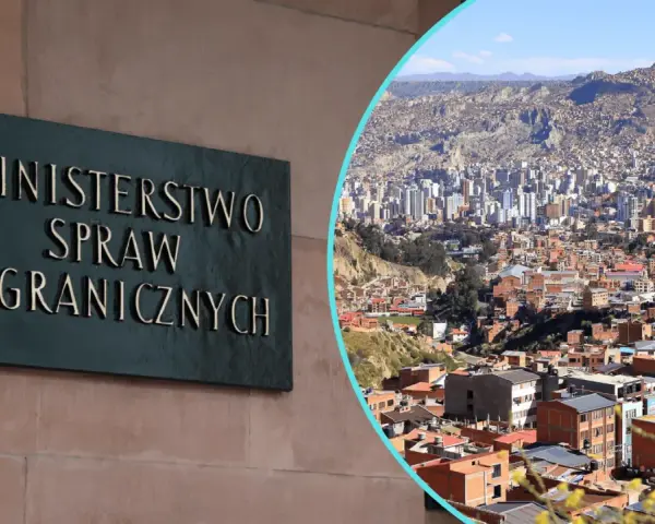 Tablica "Ministerstwo Spraw Zagranicznych" obok panoramy miasta, gdzie nie jechać.