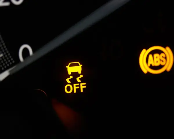 Dashboard lights show the ESC system is OFF, alongside ABS and seatbelt warnings.