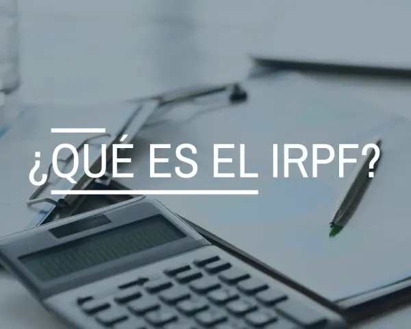 Calculadora y bolígrafo sobre documentos. El texto principal es "¿Qué es el IRPF?", una clave para entender tus finanzas.