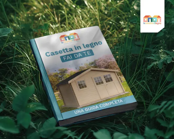Guida completa su come costruire una cassetta in legno fai da te. Immagine di un libro aperto sull'erba con la copertina che mostra una casetta di legno.