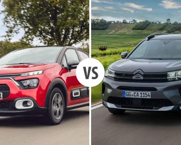 Dwa modele Citroen SUV: czerwony i ciemnoszary, jadące po drodze.