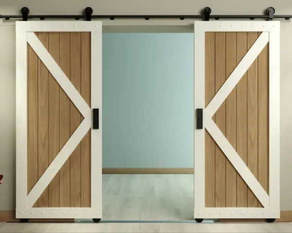 Two white-trimmed, wooden barn doors with black hardware slide open on a black track, showcasing a room beyond. This image illustrates how to install barn door hardware.