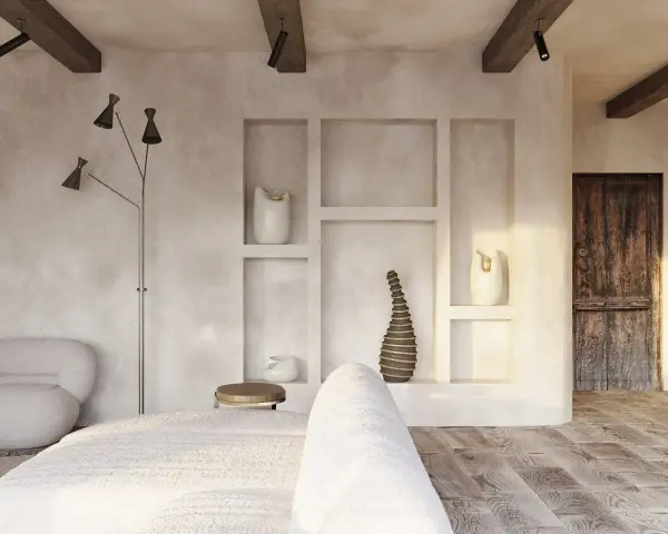 Wnętrze w stylu wabi sabi: surowe tynki, drewniane belki, rustykalne drzwi i minimalistyczne dekoracje tworzą spokojną atmosferę.