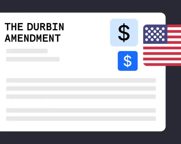 A document titled "The Durbin Amendment" with dollar signs and the US flag, symbolizing financial regulation.