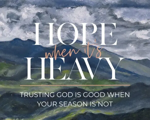 Hope when it's heavy. Trusting God is good when your season is not. A painted mountain landscape under stormy skies.