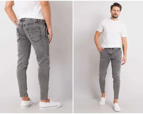 Szare jeansy męskie z przetarciami, dopasowane, z białym t-shirtem i białymi slip-onami.