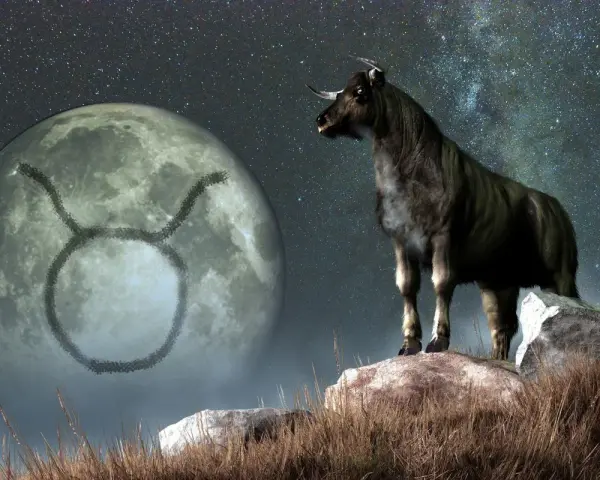 Byk na tle księżyca z symbolem zodiaku. Jego ascendent w byku zapowiada siłę i stabilność.