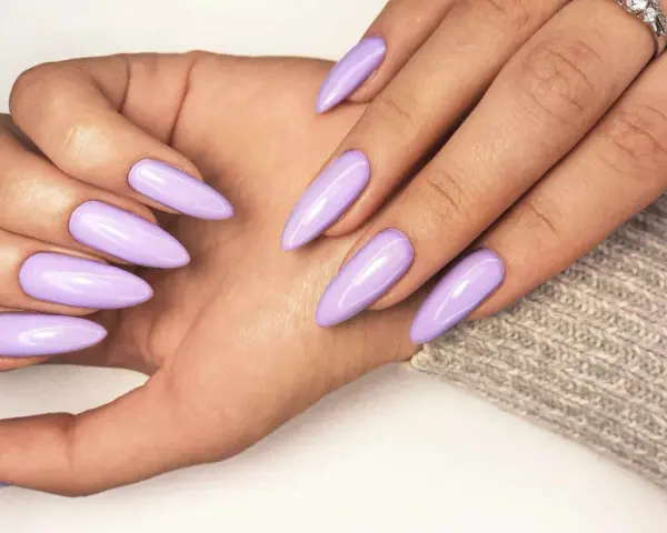 Beautiful lavender acrylic nails, a stylish choice that proves acrylic doesn't have to be expensive.