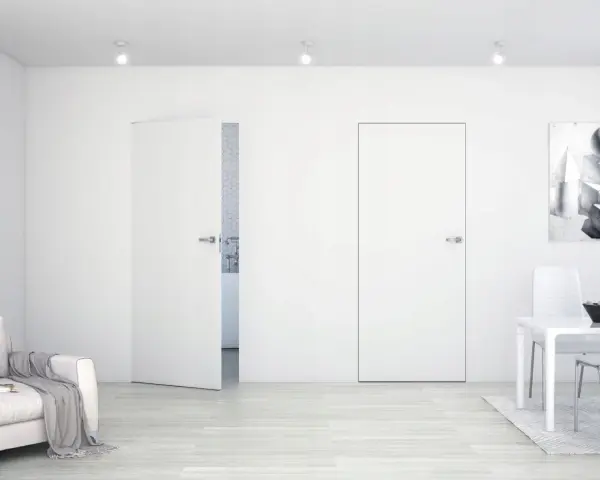 Minimalistyczne wnętrze z drzwiami Sara Eco. Jasna sofa, stół z krzesłami i obraz na ścianie.
