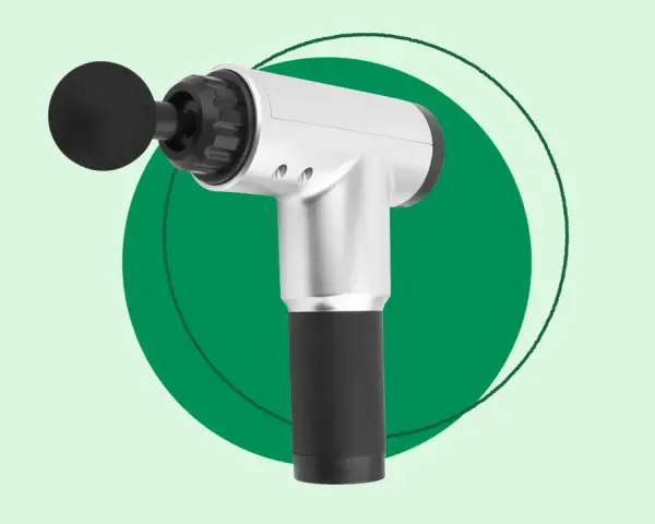 A silver and black handheld massager with a round attachment, perfect for exploring how handheld massagers work for muscle relief.