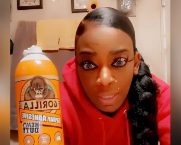 A woman holds a can of Gorilla Glue, wondering if Gorilla Glue works on plastic.