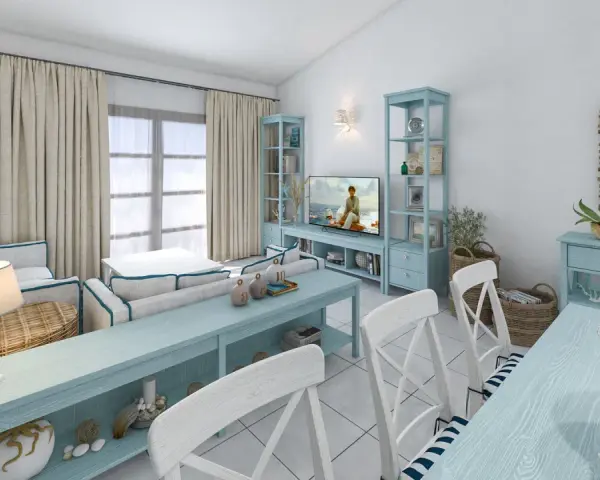 Un soggiorno in stile marinaro con mobili azzurri, cuscini a righe, ancore decorative e un tocco di stile da polo e scarpe da barca.