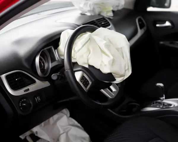 The driver's side airbag has deployed. This image raises the question: can airbags be replaced after an accident?