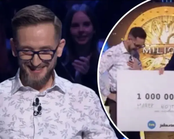 Marek Wojtun wygrał milion w Milionerach! Uśmiechnięty uczestnik odbiera czek z nagrodą.