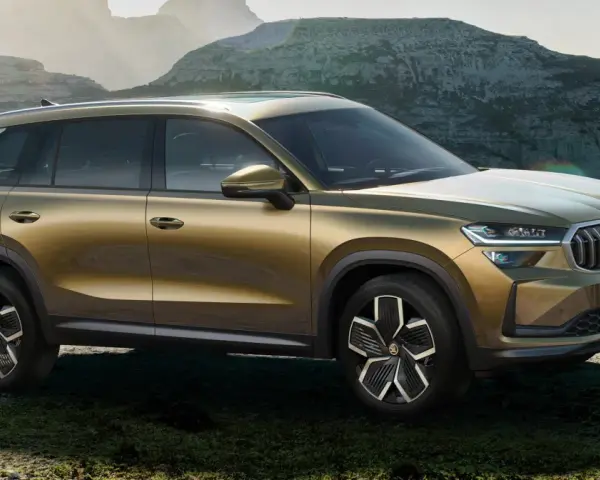 Złoty Skoda Kodiaq na tle górskich krajobrazów. Sprawdź aktualną Skoda Kodiaq cenę i odkryj przygodę!