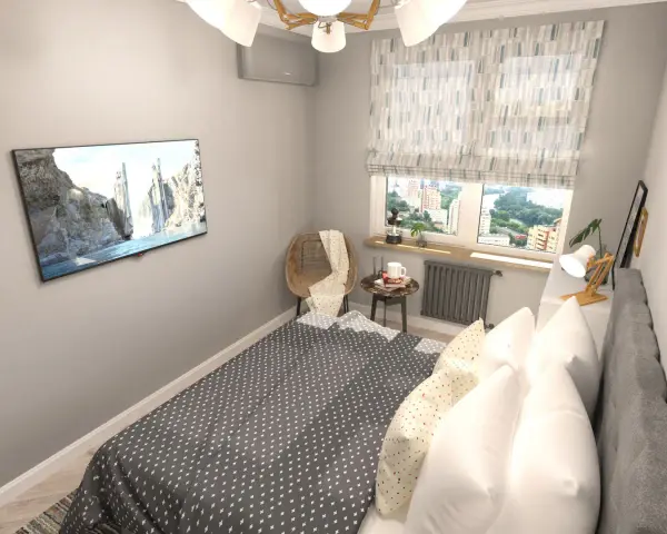 Acogedora habitación pequeña con cama, TV en la pared y ventana con vistas a la ciudad.