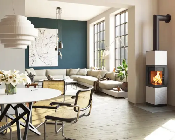 Poêle à bois moderne dans un salon lumineux avec canapé et table à manger.