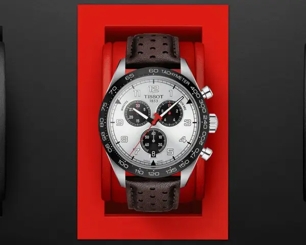 Zegarek Tissot z czarnym bezelem, na którym widnieje skala tachymetru. Skórzany pasek dodaje mu elegancji.