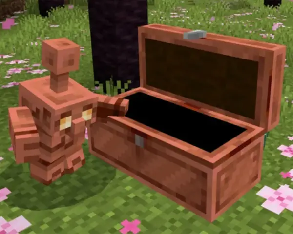 Un golem de cobre, con su cuerpo brillante, se asoma a un cofre abierto en un campo cubierto de flores rosadas.