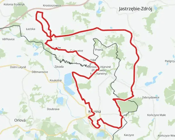 Mapa z zaznaczonym czerwonym szlakiem rowerowym, prowadzącym przez tereny z nazwami miejscowości jak Karviná, Jastrzębie-Zdrój. Idealne miejsce na **żelazny szlak rowerowy parking**.