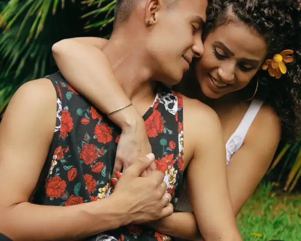 A couple embraces, their faces close, a tender moment that hints at the powerful pull of lust.