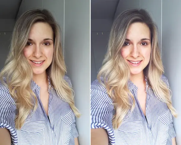 Uśmiechnięta blondynka w pasiastym, rozpiętym kołnierzyku robi sobie selfie.
