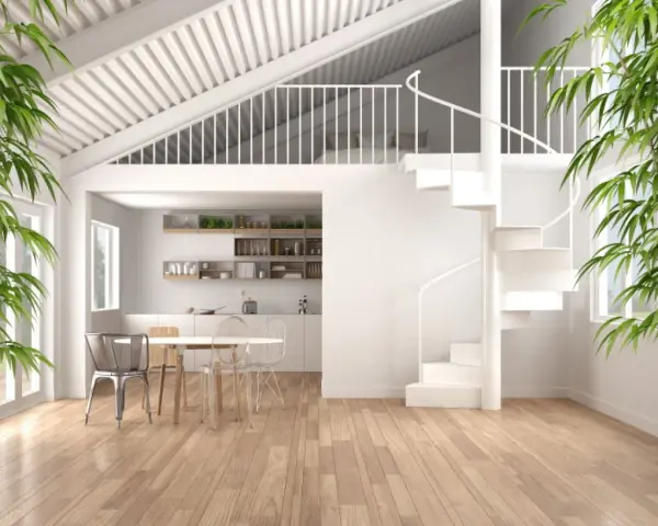 Interni moderni con cucina, zona pranzo e soppalco chiuso con letto visibile. Scale a chiocciola bianche per idee soppalco chiuso.