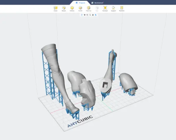 Modele do druku 3D: nogi i strój, przygotowane na platformie Anycubic. Widoczne są podpory, kluczowe dla udanego druku.