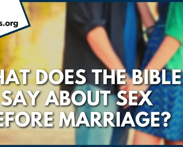 GotQuestions.org asks: What does the Bible say about sex before marriage? A couple holds hands, hinting at the topic.