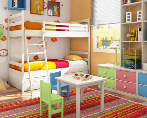Cameretta bambino 6 anni con letto a castello, scrivania, tappeto colorato e libreria piena di giochi e libri.