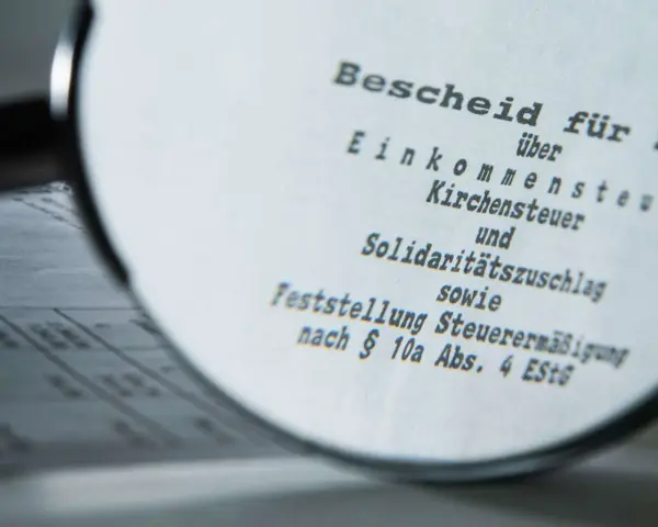 Bescheid über Einkommensteuer, Kirchensteuer und Solidaritätszuschlag. Möglicherweise muss man Kirchensteuer nachzahlen.