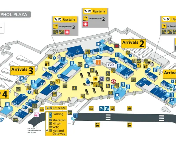 Plan lotniska w Amsterdamie Schiphol Plaza z oznaczeniami przylotów, odlotów i udogodnień.