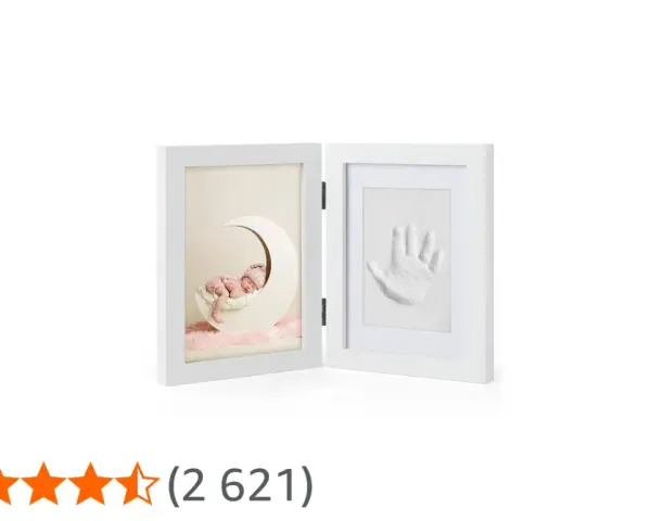 A white diptych frame showing a sleeping baby on a moon and a baby handprint.
