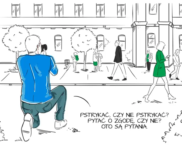 Fotograf klęczy, by zrobić zdjęcie. Zastanawia się, czy pytać o zgodę, jak w umowie rodo dla fotografa.