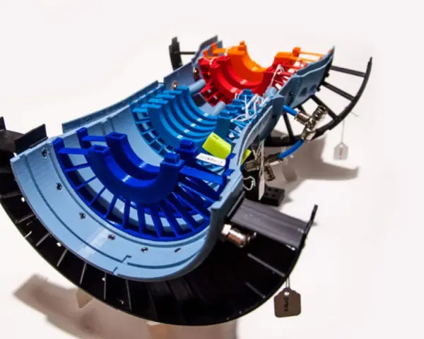 A colorful 3D printed model of a jet engine turbine, showcasing advancements in 3D printing aerospace technology.