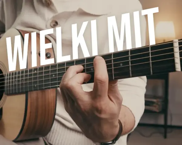Ręce grające na gitarze, tekst "WIELKI MIT" sugeruje, że samodzielna nauka gry na gitarze jest możliwa.