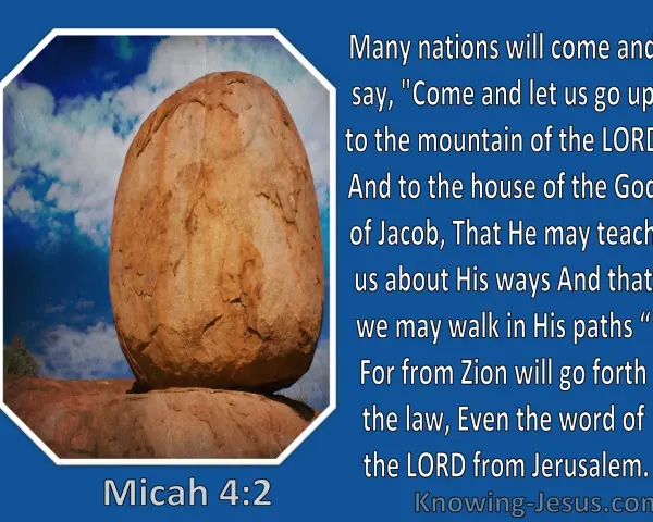 A large, weathered boulder rests precariously on smaller rocks under a blue, cloudy sky, illustrating a verse from Micah in the Bible.