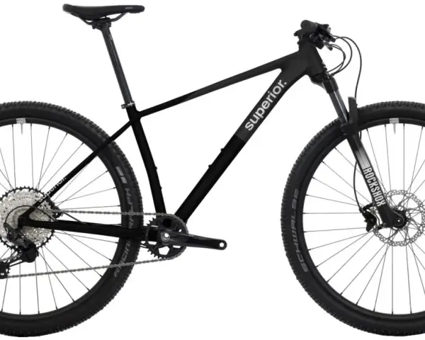 Sleek black mountain bike with "Superior." branding, ready for any road or trail. Features RockShox fork and Schwalbe tires.