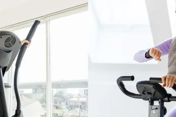 A woman uses a cross trainer while another checks her watch on an exercise bike, showcasing two popular cardio options.