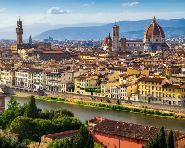 Florence skyline with the Arno River, featuring the Duomo and Palazzo Vecchio, iconic landmarks near the Uffizi Gallery and Accademia.