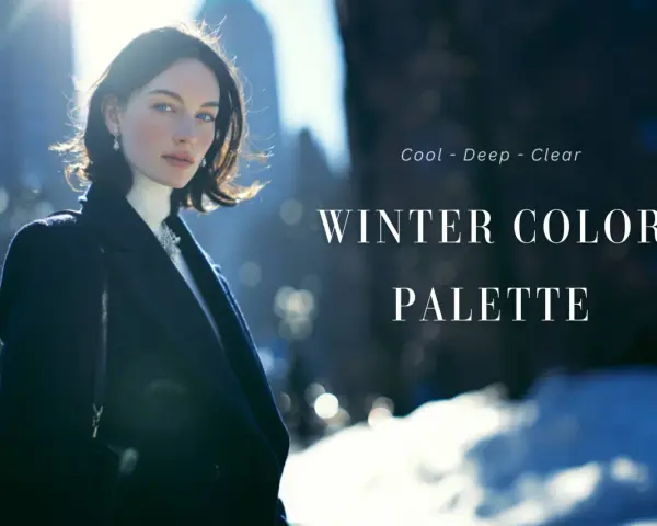 Mujer con abrigo oscuro y cuello alto blanco, reflejando la paleta de colores de la **temporada de invierno**: fríos, profundos y claros.