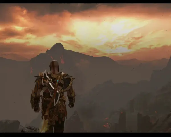 Kratos, el dios de la guerra, contempla el paisaje infernal de Muspelheim bajo un cielo ardiente.
