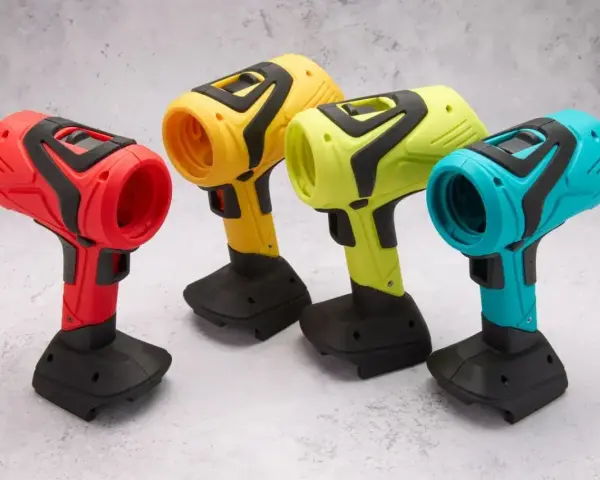 Spools of colorful 3D printing filament and containers of material on a wooden surface.