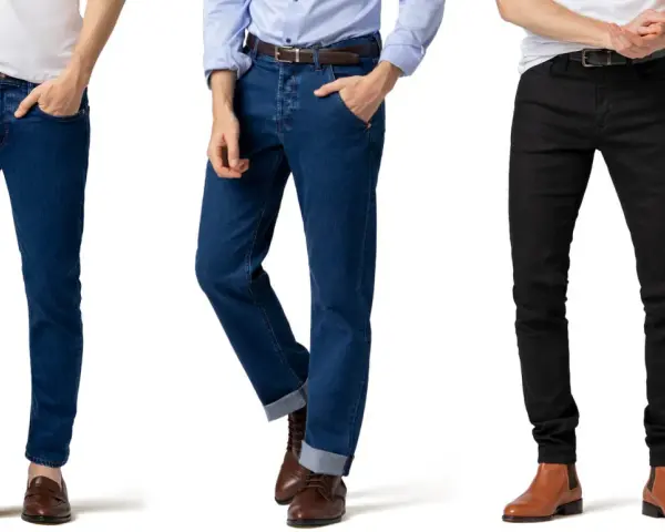 Tre uomini mostrano diversi outfit ufficio jeans: blu scuro, blu medio con risvolto e neri.