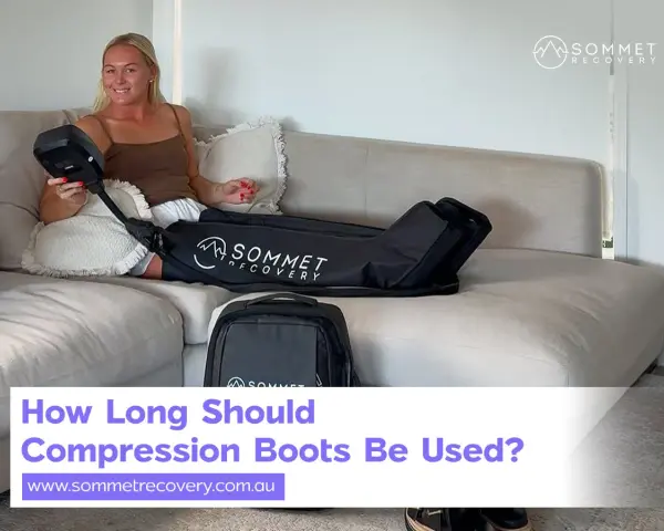 Woman on couch with compression boots. Learn how often should you use compression boots for optimal recovery.