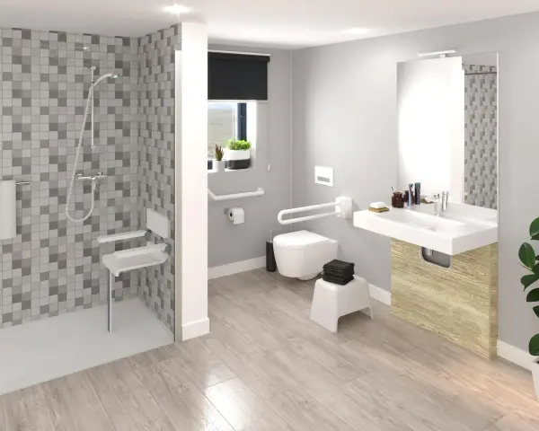 Salle de bain moderne avec douche, lavabo et toilettes adaptées. Des barres d'appui et un siège de douche pliable assurent l'accessibilité.