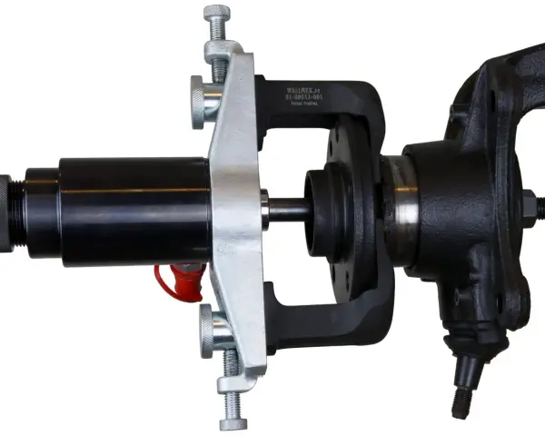 Automotive hub bearing removal and installation tool with a black hydraulic cylinder and silver clamp.