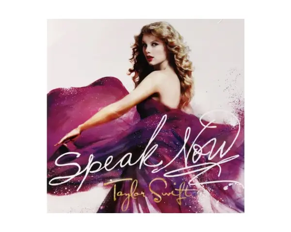 Taylor Swift w fioletowej sukni, z napisem "Speak Now".
