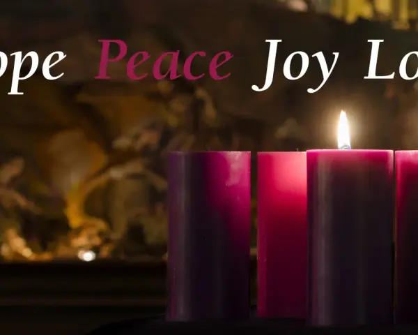 Three lit candles, representing the second week of Advent, glow with "Hope, Peace, Joy, Love" in elegant script.
