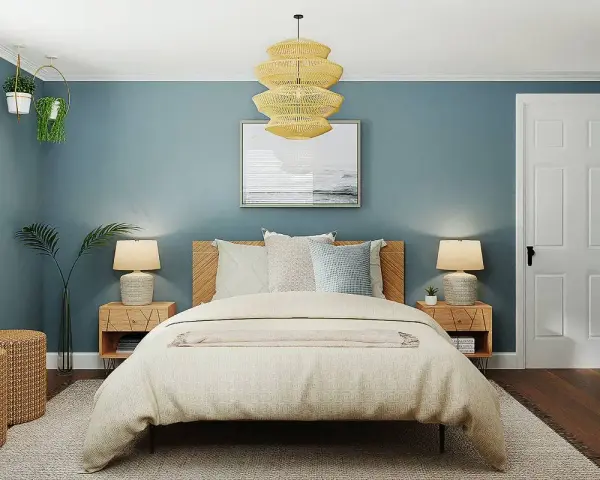 Habitación con paredes azul petróleo, cama acogedora y detalles en madera. Ideas de colores para habitaciones que inspiran calma y serenidad.